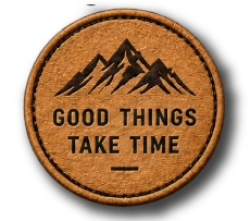 Round embroidered patch featuring a mountain design and Good Things Take Time text